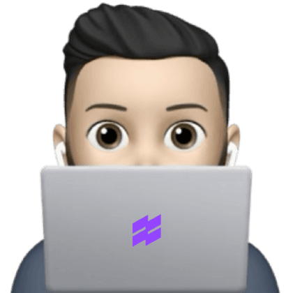 A person peeking from behind the laptop